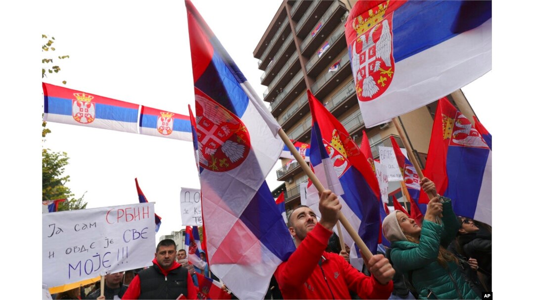 FILE - Kosovo Serbs wave Serbian flags during a protest in Mitrovica, Kosovo, Nov. 6, 2022. Several thousand ethnic Serbs rallied in Kosovo after a dispute over vehicle license plates.