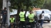 Iran's police forces stand on a street during the revival of morality police in Tehran, July 16, 2023. (Majid Asgaripour/WANA (West Asia News Agency) via Reuters)
