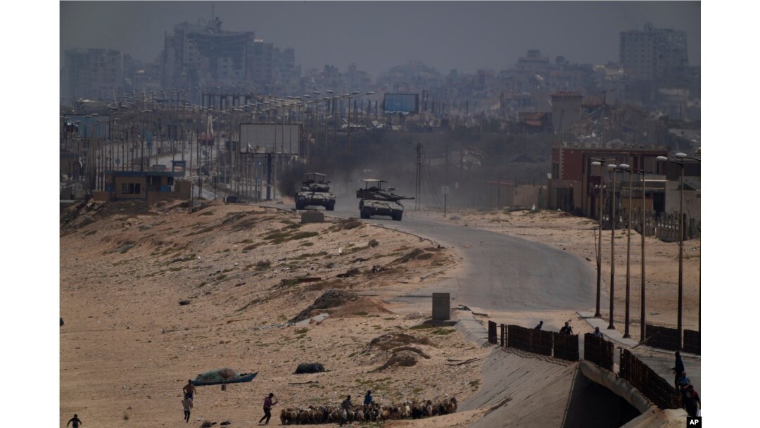 Israeli army tanks are seen in the central Gaza Strip, May 18, 2024.