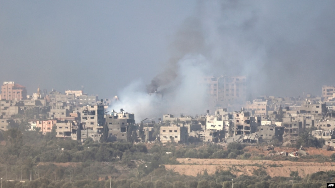 This picture taken from the Israeli border with the Gaza Strip shows smoke billowing over central Gaza following Israeli strikes on Dec. 31, 2023.