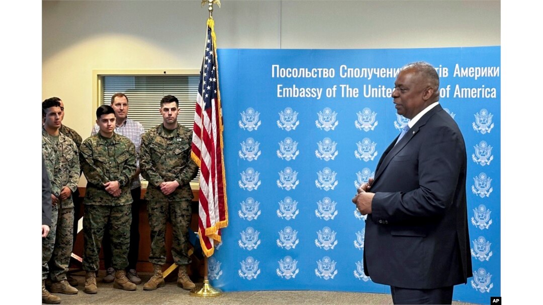 U.S. Secretary of Defense Lloyd Austin, right, speaks to employees of the U.S. embassy in Kyiv, Nov. 20, 2023.