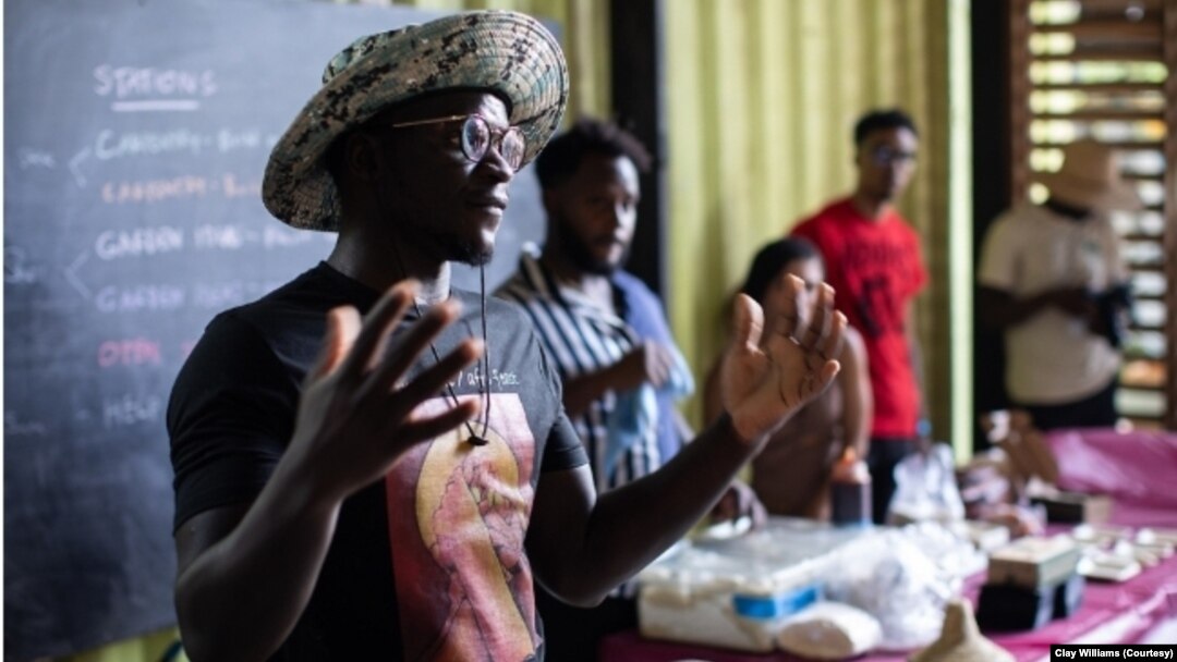 Chef Serigne Mbaye speaks to the crowd at the Afro Freedom/Afro Feast Juneteenth celebration at Grow Dat Youth Farm in New Orleans on June 19, 2023. Mbaye works to spotlight African-influenced cuisine at his New Orleans restaurant Dakar NOLA.