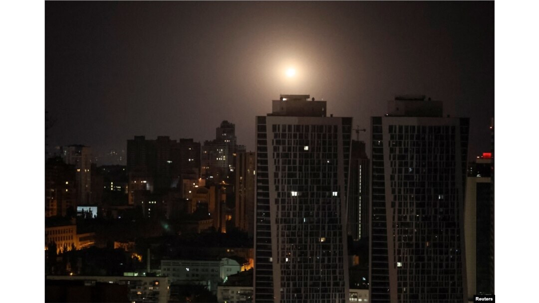An explosion is seen in the sky over the city during a Russian missile and drone strike in Kyiv, Ukraine, Aug. 11, 2024.