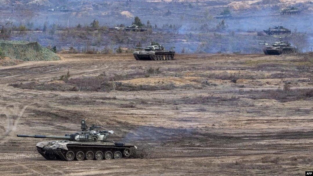 This handout video grab released by the Russian Defense Ministry on Feb. 21, 2022, shows Russian and Belarus tanks during joint exercises near Brest, Belarus.