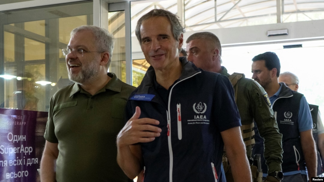 IAEA Director General Rafael Mariano Grossi and Ukrainian Minister of Energy German Galushchenko walk as the International Atomic Energy Agency mission arrives in Zaporizhzhia amid Russia's invasion of Ukraine, in Zaporizhzhia, Ukraine, Aug. 31, 2022.