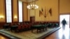A man walks through the hall where a conditional surrender was signed at the German-Russian Museum in Berlin, May 8, 2014.