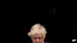 British Prime Minister Boris Johnson leaves 10 Downing Street to attend the weekly Prime Minister's Questions at the Houses of Parliament, in London, May 25, 2022.