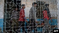 FILE - Suspects in a gang-rape case are led by police to a district courthouse in Bolpur of Birdhum district, India.