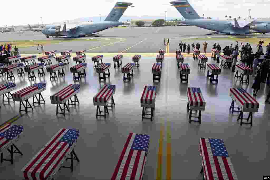 Flag draped transfer cases with the remains of American soldiers repatriated from North Korea are seen during a repatriation ceremony after arriving at Joint Base Pearl Harbor-Hickam, Honolulu, Hawaii, Aug. 1, 2018. Sixty-five years after the Korean War ended, the remains of dozens of American soldiers killed during the brutal conflict are finally coming home.