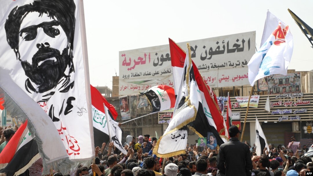 Iraqis demonstrate to denounce rising prices of basic food items, in al-Haboubi Square in the center of Iraq's city of Nasiriyah in the southern Dhi Qar province on March 9, 2022. 
