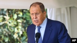 In this handout photo released by the Russian Foreign Ministry Press Service, Russian Foreign Minister Sergey Lavrov speaks during a news conference with Ugandan President Yowerei Museveni (not pictured) in Entebbe, Uganda, July 26, 2022. From Uganda, Lavrov heads to Ethiopia.