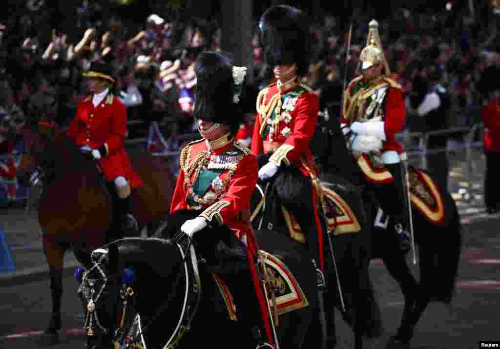 Britain's Prince Charles and Prince William ride on horseback during the Trooping the Color parade in celebration of Britain's Queen Elizabeth's Platinum Jubilee, in London, June 2, 2022.