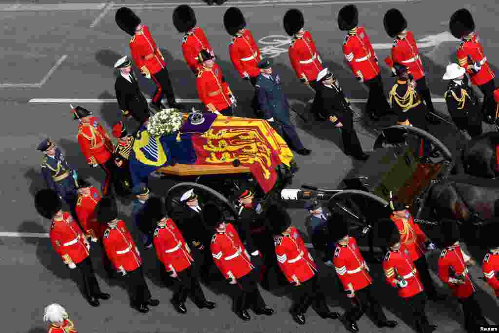The procession of the coffin of Britain's Queen Elizabeth moves from Buckingham Palace to Westminster Hall in London, Sept. 14, 2022.