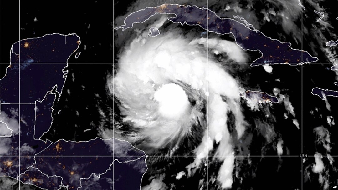 This satellite image provided by the National Oceanic and Atmospheric Administration shows Tropical Storm Ian over the central Caribbean, Sept. 26, 2022. 