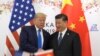 FILE - U.S. President Donald Trump, right, shakes hands with Chinese Vice Premier Liu He after being given a letter in the Oval Office of the White House in Washington, Oct. 11, 2019.. 