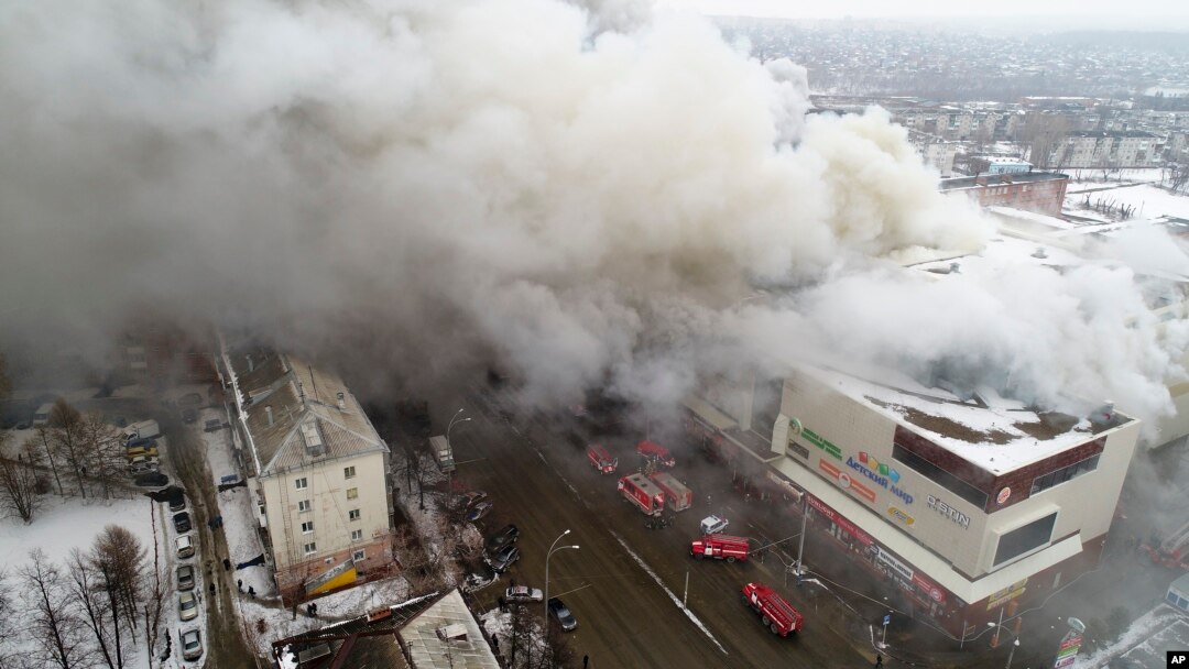 In this Russian Emergency Situations Ministry photo, on Sunday, March 25, 2018, smoke rises above a multi-story shopping center in the Siberian city of Kemerovo, about 3,000 kilometers (1,900 miles) east of Moscow, Russia. 