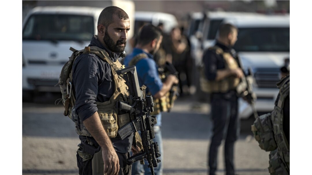 FILE - Members of the Kurdish-led Syrian Democratic Forces (SDF) are pictured during preparations to join the front against Turkish forces, near the northern Syrian town of Hasakeh, Oct. 10, 2019.