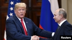 Shugaba Trump tare Shugaban Rasha Vladimir Putina lokacin da suka gana a Helsinki a ranar 16 ga watan Yuli.