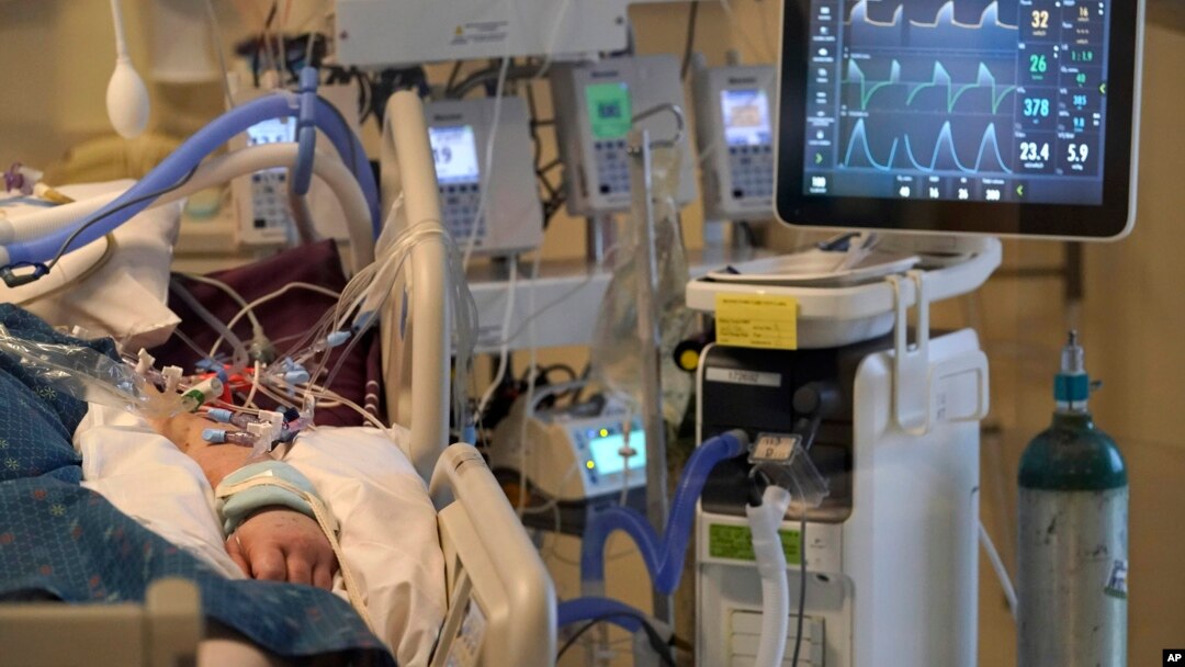 A COVID-19 patient is seen on life-support in the COVID-19 Intensive Care Unit at Dartmouth-Hitchcock Medical Center, in Lebanon, New Hampshire, Jan. 3, 2022.