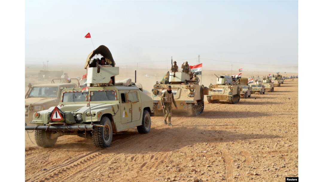 Iraqi forces' vehicles are seen after the fighters captured Rawa town, the last remaining town under Islamic State control, Nov. 17, 2017.
