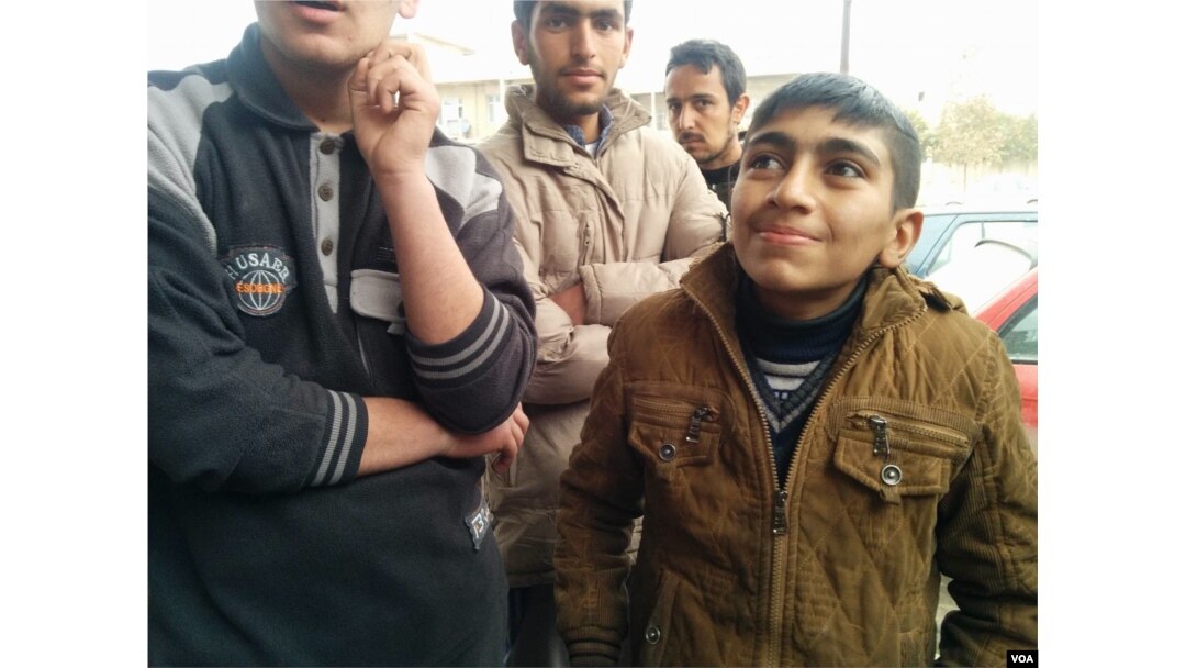 Ali, a 14-year-old breadwinner, told IS militants he couldn't join because of school, but in reality he had witnessed brutal executions, Jan. 27, 2017, in Mosul Iraq. (H.Murdock/VOA)
