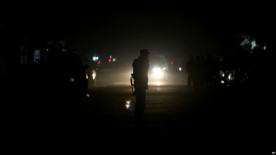 Afghan security forces patrol the site of an attack on an Afghan parliament member's house in western Kabul, Afghanistan, Dec. 21, 2016.