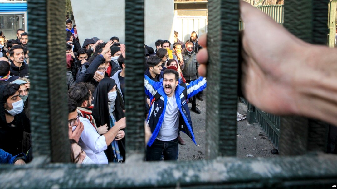 FILE - In a photo, taken by an individual not employed by the Associated Press and obtained by the AP outside Iran, university students attend an anti-government protest inside Tehran University, in Tehran, Iran, Dec. 30, 2017. 