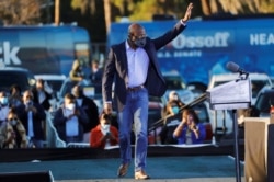 FILE - Then-Democratic U.S. Senate candidate the Rev. Raphael Warnock arrives at a campaign event ahead of Georgia's runoff elections in Savannah, Jan. 3, 2021.