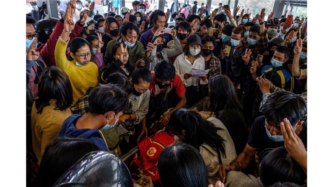 Mourners make the three-finger salute as they attend the funeral of a protester, who died amid a crackdown by security forces on demonstrations against the military coup, in Taunggyi in Myanmar's Shan state, March 29, 2021.