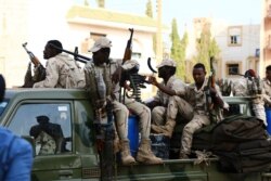Military forces secure the area outside while Sudan's ousted president Omar al-Bashir is questioned at the prosecutor's office over charges of corruption and illegal possession of foreign currency, in Khartoum, June 16, 2019.