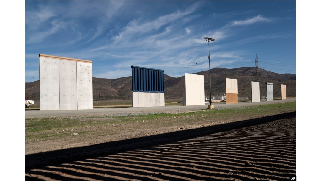 FILE - Border wall prototypes stand in San Diego, California, near the U.S.-Mexico border, as seen from Tijuana, Mexico, Dec. 22, 2018.