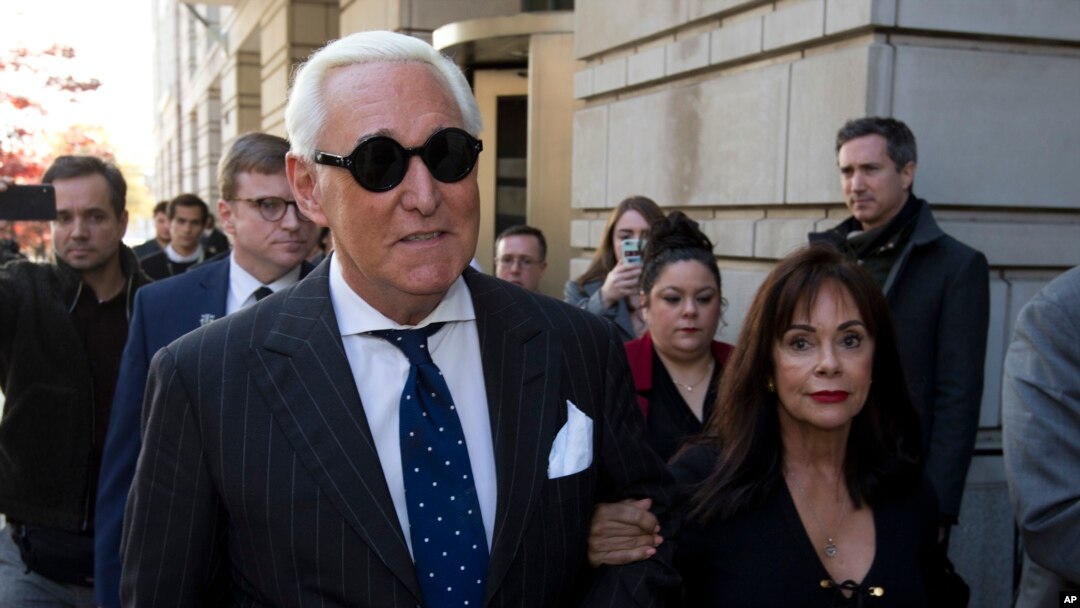 FILE - In this Nov. 15, 2019, file photo, Roger Stone, left, with his wife Nydia Stone, leaves federal court in Washington, Friday, Nov. 15, 2019. Federal prosecutors are asking a judge to sentence Stone to serve between 7 and 9 years in prison…