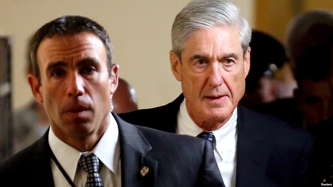 FILE : Special Counsel Robert Mueller (R) departs after briefing members of the U.S. Senate on his investigation into potential collusion between Russia and the Trump campaign on Capitol Hill in Washington, U.S., June 21, 2017.
