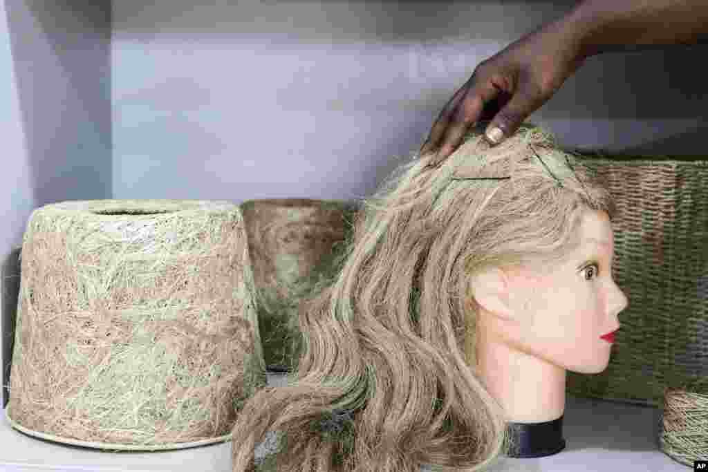 A view of a banana fiber wig and lampshades displayed at TEXFAD Showroom in Kira, Wakiso District, Uganda, Sept. 20, 2023. 