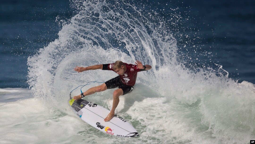 FILE - Hawaiian surfer Mick Fanning competes in the 2015 Oi Rio Pro World Surf League competition at Barra da Tijuca beach in Rio de Janeiro, Brazil, May 12, 2015.