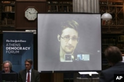 National Security Agency leaker Edward Snowden speaks via video link during the Athens Democracy Forum, organized by The New York Times, at the National Library in Athens, Sept. 16, 2016.