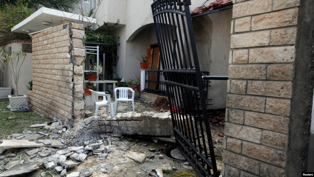 A general view of the damage caused by a bomb blast is seen at the gate of the Iranian ambassador's residence in Tripoli, Libya, Feb. 22, 2015.