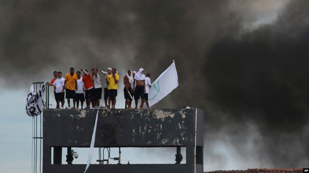 Inmates at the Puraquequara prison stand on a water tower as they protest against bad conditions and restrictions on family visits put in place to curb the spread of the new coronavirus in Manaus, Brazil, May 2, 2020. 