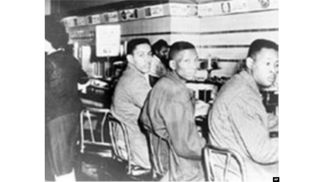 Four North Carolina A&T College students, including Ronald Martin (left) and Robert Patterson, were arrested for sitting at a Woolworth’s lunch counter in Greensboro, North Carolina, in 1960.