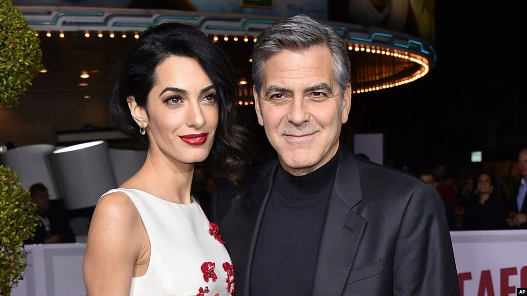 FILE - Amal and George Clooney are pictured in Los Angeles, Feb. 1, 2016. They are donating funds to and will participate in the "March for Our Lives" rally in Washington on March 24, 2018.