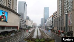 FILE - A street view after the Wuhan government announced to ban nonessential vehicles in a downtown area to contain the coronavirus outbreak, on the second day of the Chinese Lunar New Year, in Wuhan, Hubei province, China, Jan. 26, 2020.