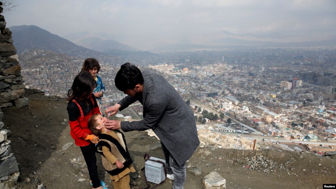 FILE - A boy receives polio vaccination drops during an anti-polio campaign in Kabul, Afghanistan.