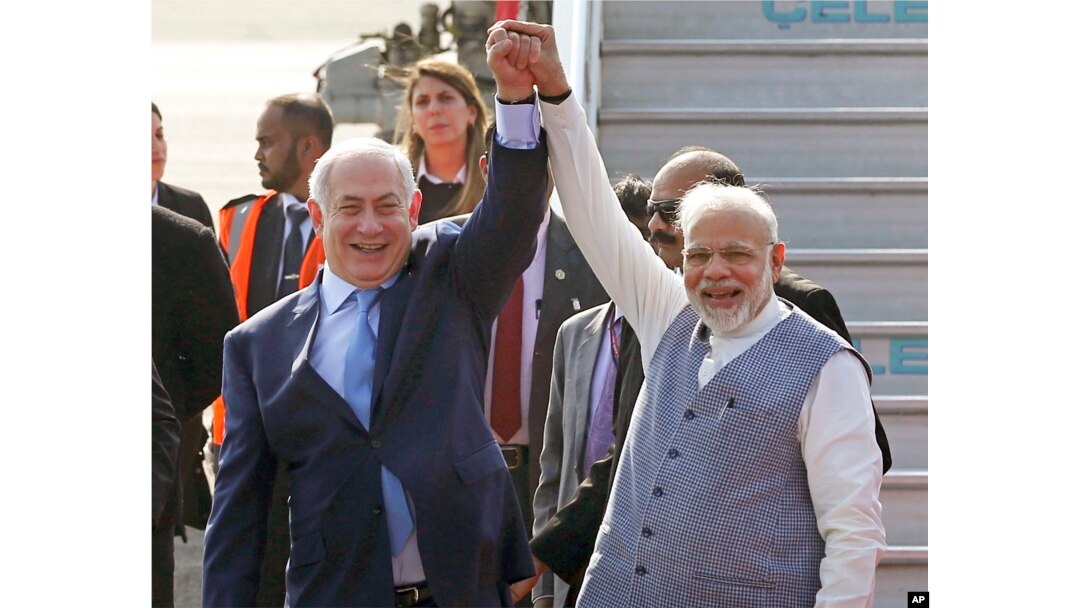 Israel's Prime Minister Benjamin Netanyahu, left, is welcomed by India's Prime Minister Narendra Modi on his arrival at Palam airport in New Delhi Sunday, Jan. 14, 2018.