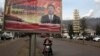FILE - A billboard shows Chinese President Xi Jinping with the slogan "To exactly solve the problem of corruption, we must hit both flies and tigers," in Gujiao, in northern China's Shanxi province, Feb. 6, 2015.