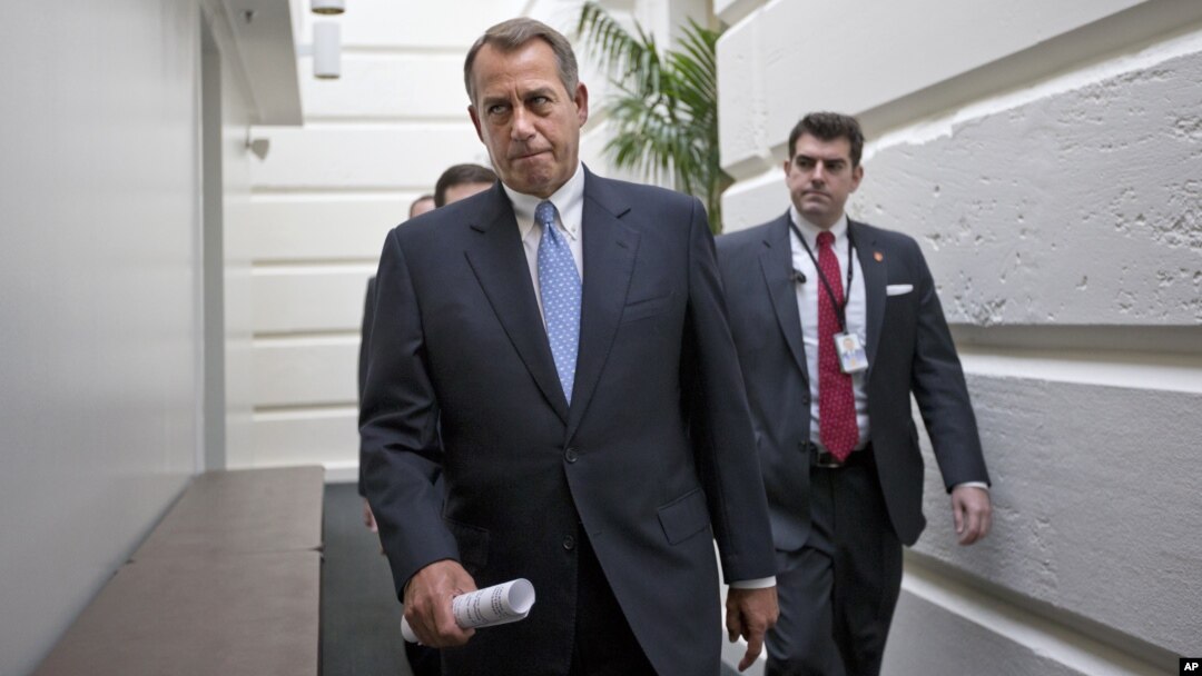 House Speaker John Boehner of Ohio walks to a closed-door Republican strategy session, Wednesday, Dec. 5, 2012, on Capitol Hill in Washington.