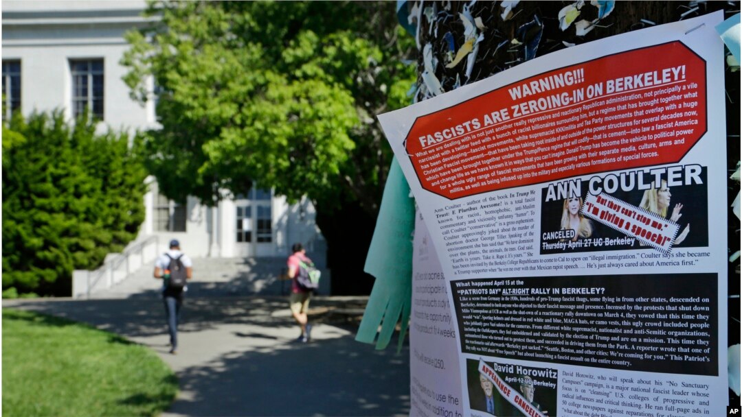 FILE - A leaflet is seen stapled to a message board near Sproul Hall on the University of California, Berkeley in Berkeley, Calif. Students who invited Ann Coulter to speak on campus filed a lawsuit, April 24, 2017, against the university, saying it is discriminating against conservative speakers and violating students’ rights to free speech.