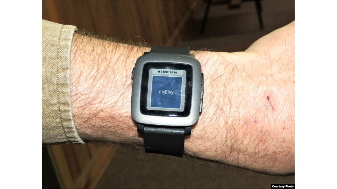 Tyler Skluzacek shows the myBivy smartphone/smartwatch application that helps military veterans suffering from PTSD sleep better at night. (Courtesy photo / T. Skluzacek)