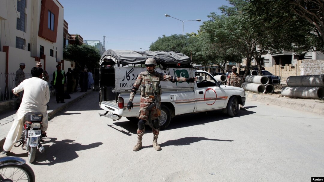 FILE - A soldier stands guard near the site where two Chinese language teachers were kidnapped by unidentified gunmen, in Quetta, Pakistan, May 24, 2017. 