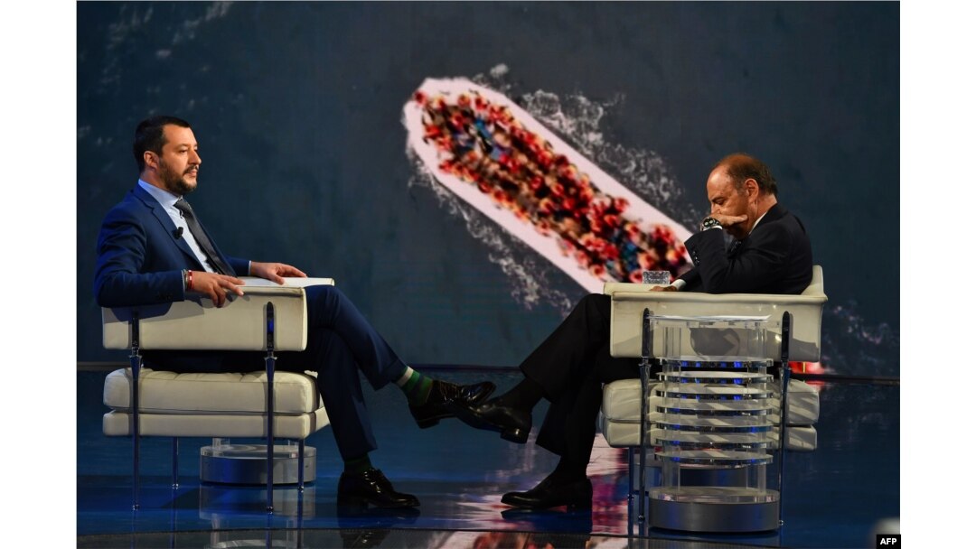 Italy’s Interior Minister and Deputy Prime Minister Matteo Salvini (L) speaks with Italian journalist Bruno Vespa, on the TV set of talk show "Porta a Porta", broadcasted on Italian channel Rai 1, in Rome, June 20, 2018.