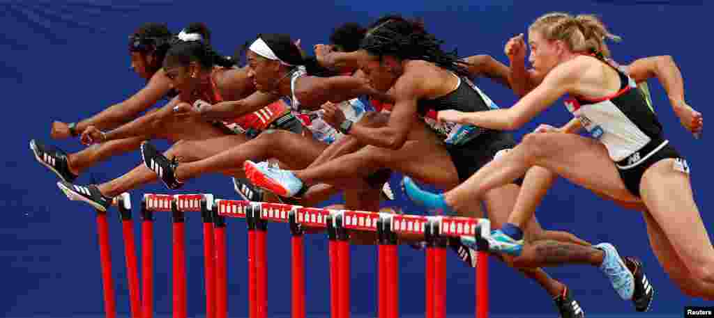 Athletes compete during the Diamond League women&#39;s 100m hurdles final at the London Stadium.